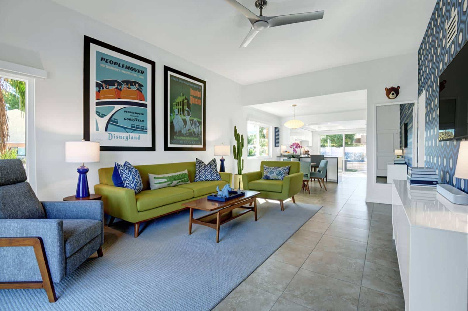 Photo of a living room in a house in Palm Springs with a green couch and blue rug